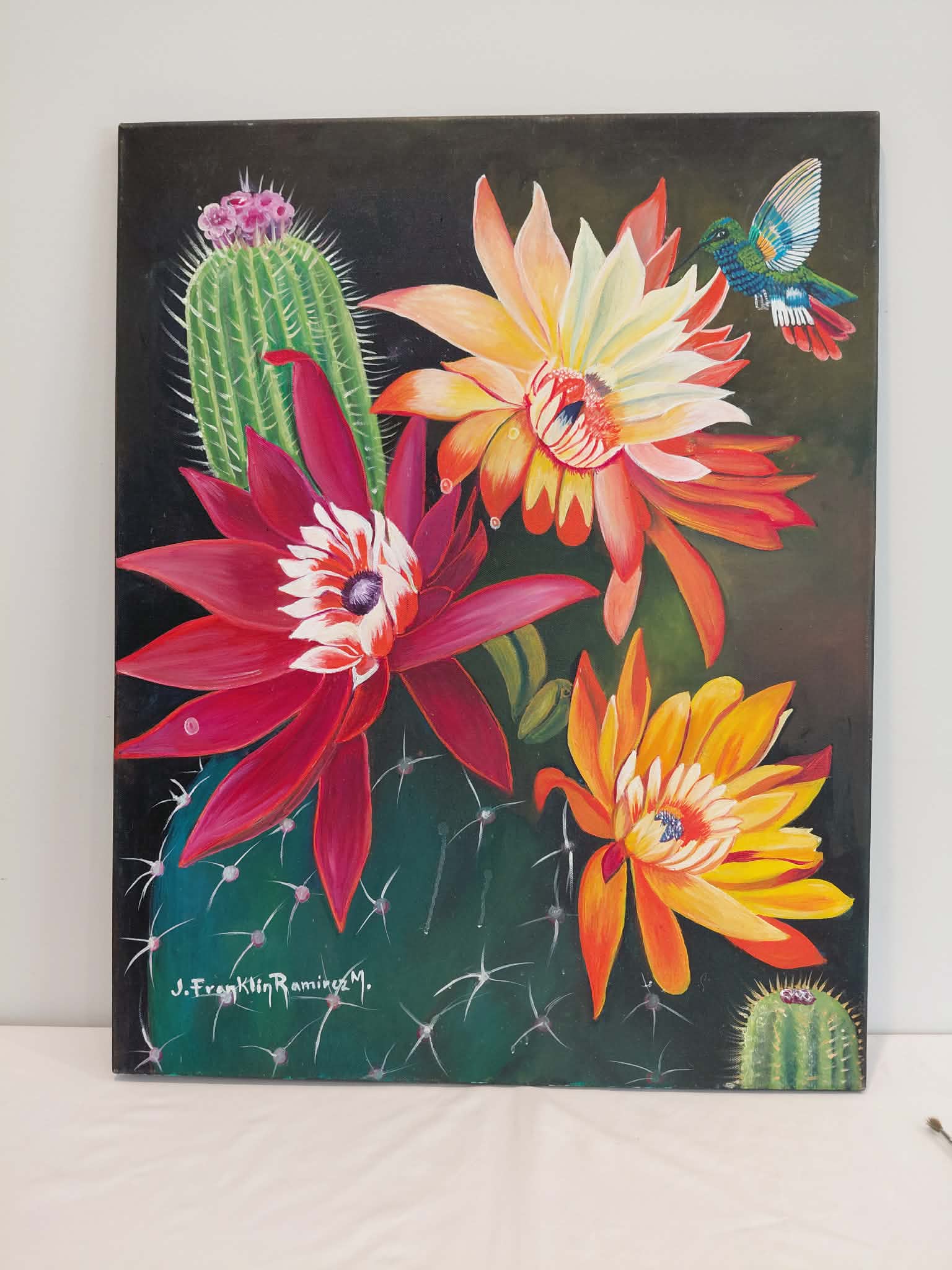 Cactus flowers + hummingbird