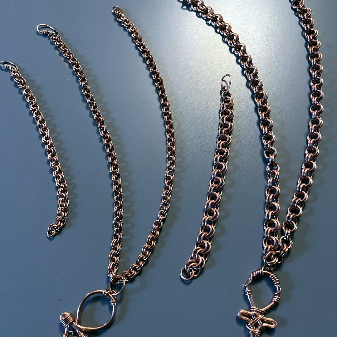 Wire-wrapped copper ankh and cross pendants on chainmaille chains
